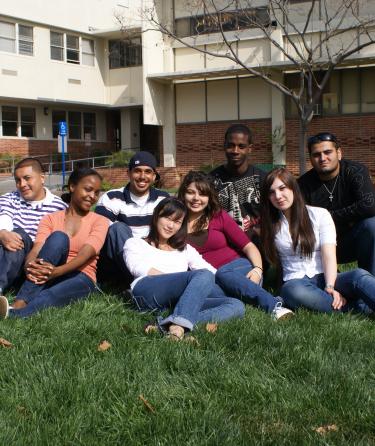 Group of Students Sitting on Grass