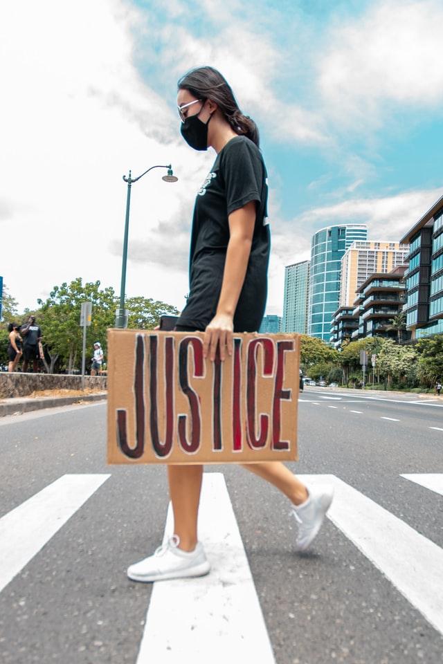 Woman With Justice Sign