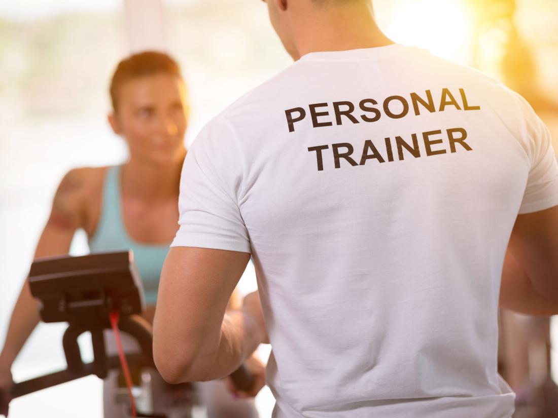Personal Trainer talking to woman.